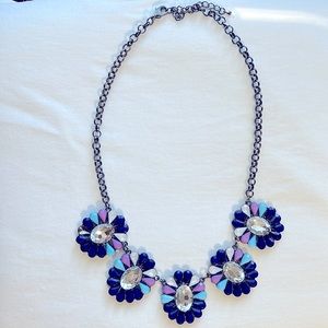 Blue and purple statement necklace. One piece missing from side flower